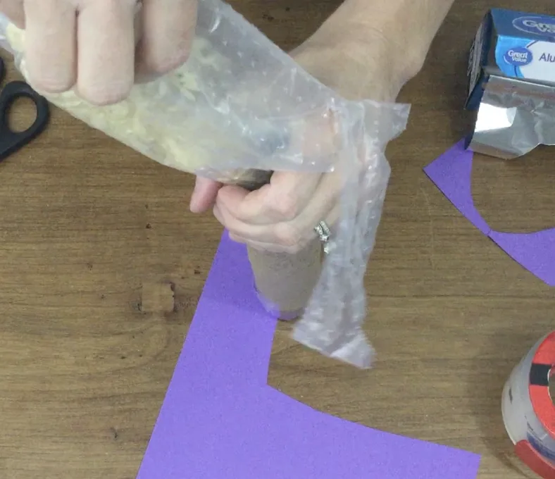 pouring rice for DIY rainstick craft
