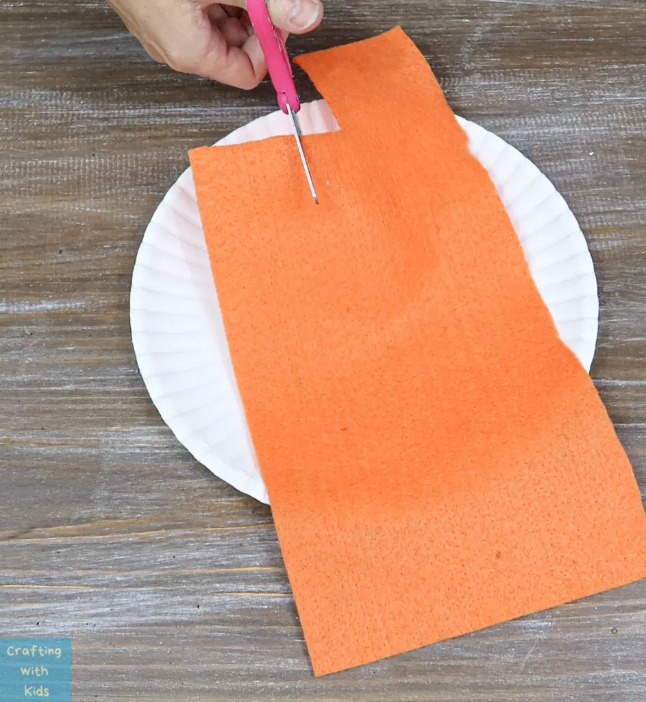 cutting orange felt for the DIY spider hair