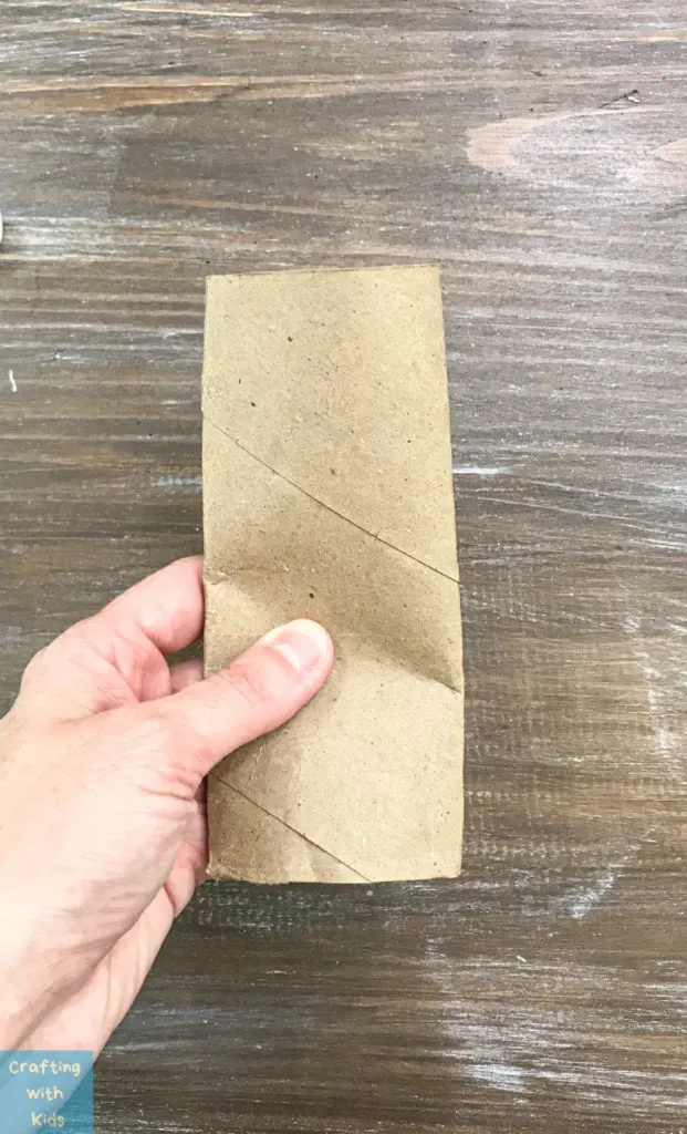 squeezing the toilet paper roll flat