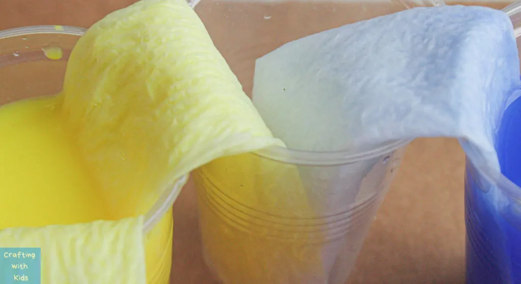 yellow water creeping into another cup