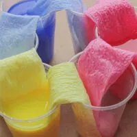 colored water moving to empty cups