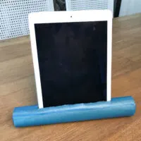 DIY vertical tablet stand from a paper towel roll