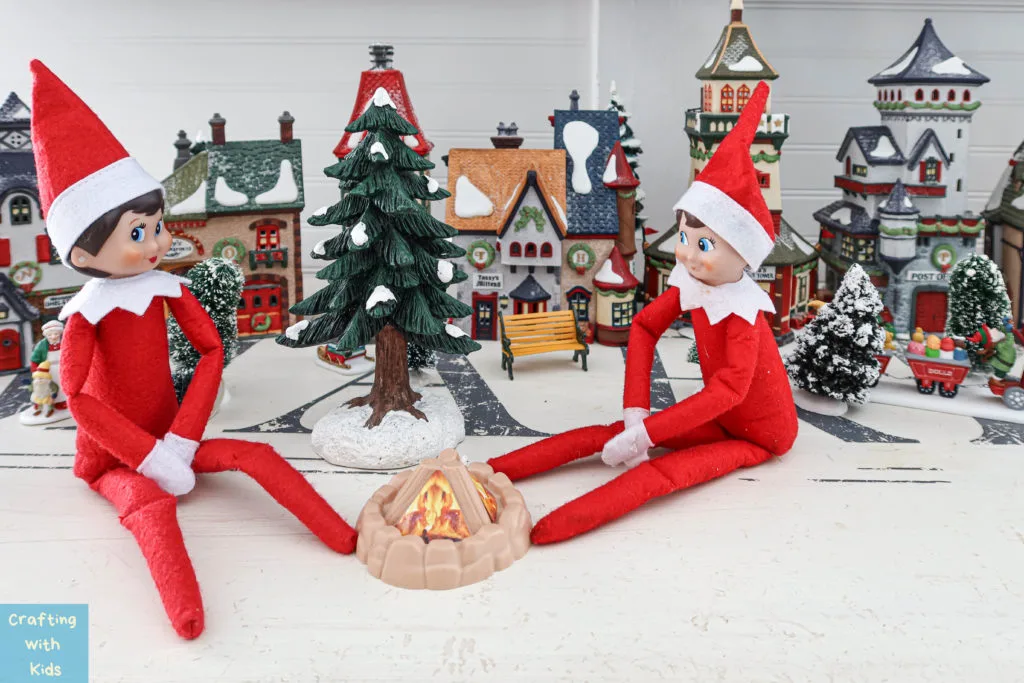 two elf on the shelf's by fire