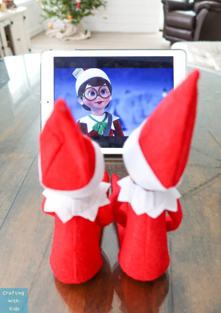 two elf on the shelf's watching a movie