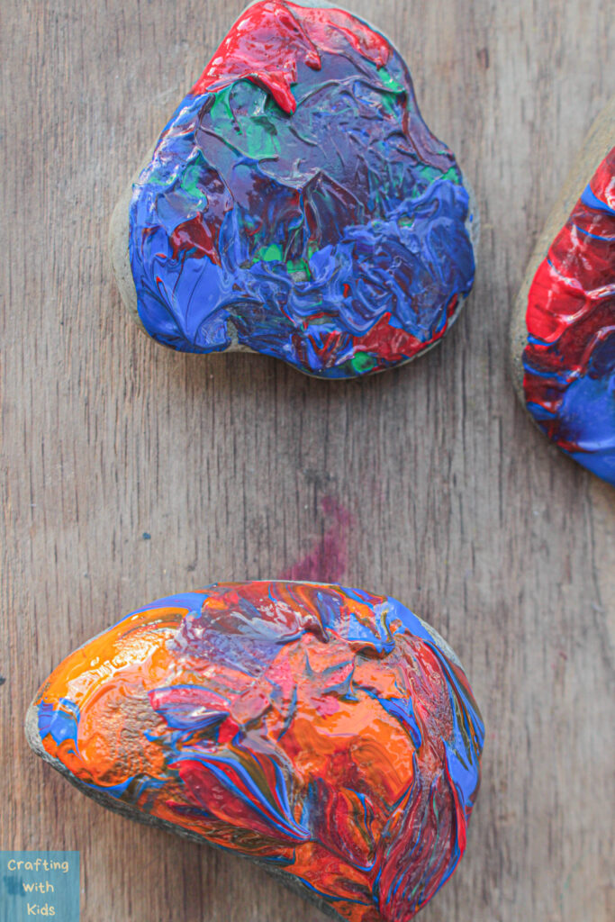 rock painting with acrylic dip paint technique