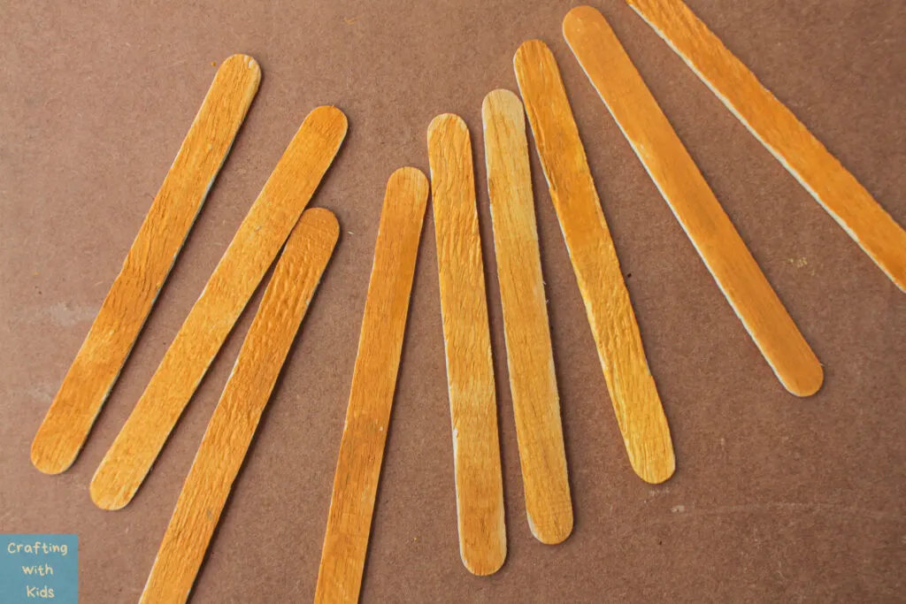 coloring popsicle sticks for pumpkins