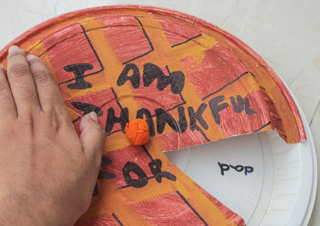 moving plate around for thankful Thanksgiving kid craft