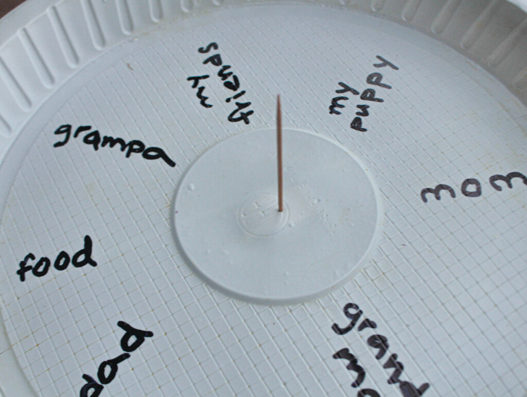 toothpick through center of paper plate