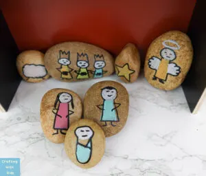 Christmas rock painting with nativity scene