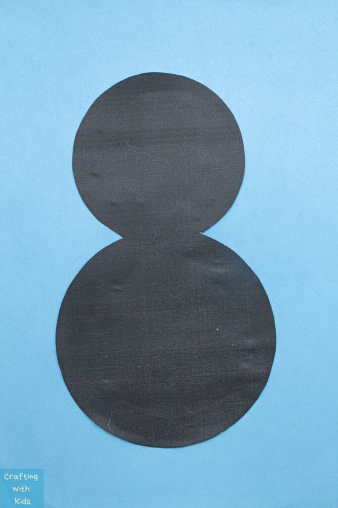 penguin base glued to blue paper