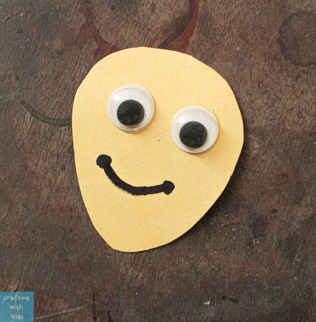 making Bee face with googly eyes