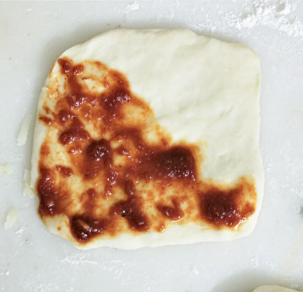 homemade pizza pocket with tomatoe sauce