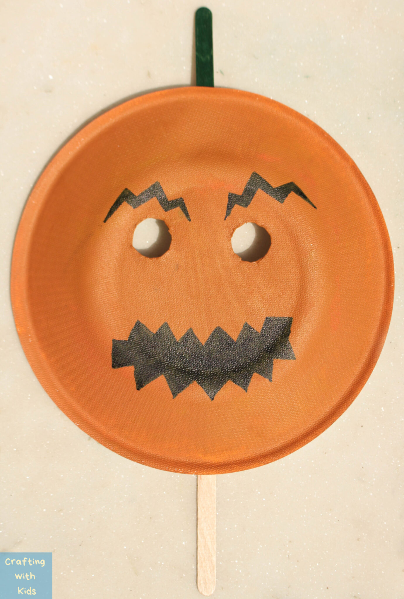 Paper Plate Pumpkin Mask for an Easy Halloween Craft