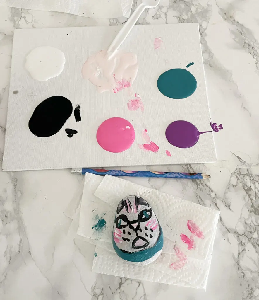 cat rock painting with acrylic paint